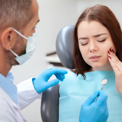 Woman experiencing tooth pain