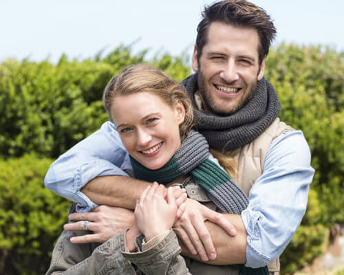 couple embracing outdoors on hike