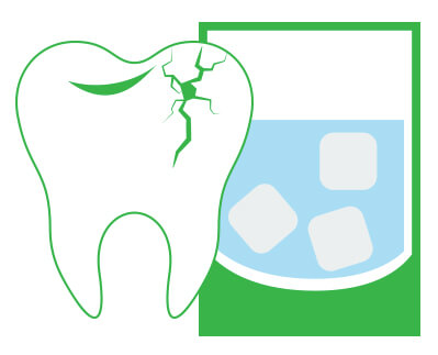 A cracked tooth next to a glass of water