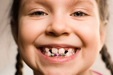 little girl smiling big with braces